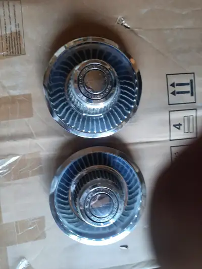 I have 2 original centre caps from Chevy Rally wheels, not plastic re-pops, nice condition , make an...