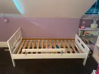 Kids bed frame for sale. Includes mattress and safety bar