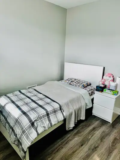 This is a basement for rent. It comes with a bed, chairs, a table, a washer, a dryer, a fridge and a...