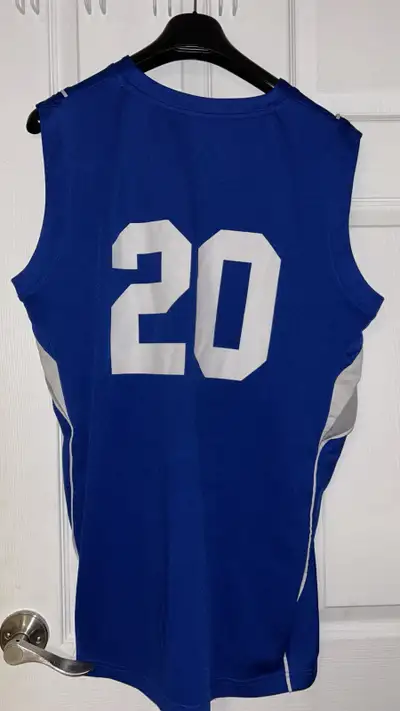 This is an XL blue Badge Security jersey, perfect for casual wear or sports activities. The jersey f...