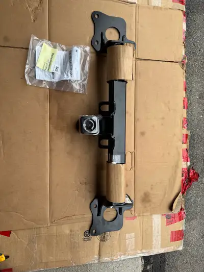 New never used. Few minor cosmetic blemishes. This hitch uses factory hardware for mounting so no ad...