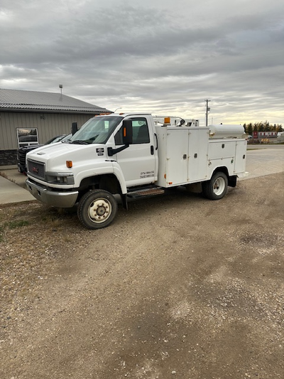 2005 GMC Topkick Mechanics Truck, with general service body, gas powered air compressor and 3000 lb...