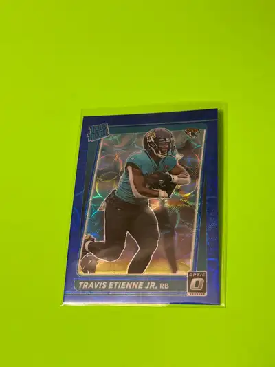 Card is NM just bad lighting in the photos. Blue Scope Rated Rookie Donruss Travis Etienne Jr from 2...