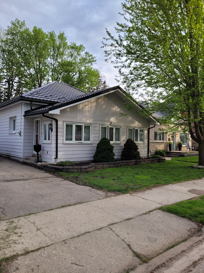 Featuring 3 Spacious bedrooms, a sunroom, kitchen, in unit laundry, large backyard with enclosed hot...