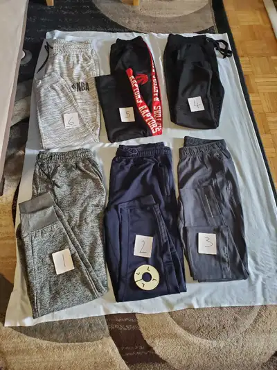 I'm selling a variety of men's and boys' track pants, all in size large. These pants are in good con...