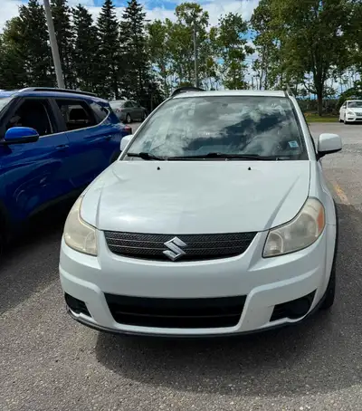 Looking for a reliable and economical ride? Check out this 2009 Suzuki SX4 hatchback! This compact c...