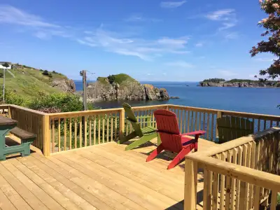 Beautiful oceanfront home with stunning views from back deck, kitchen and master bedroom. Adjacent t...
