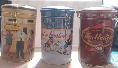 These three pre-owned Tim Hortons collectible tins are in good, well-kept condition and feature uniq...