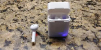Airbuds Air 1 Charger and Left Headphone