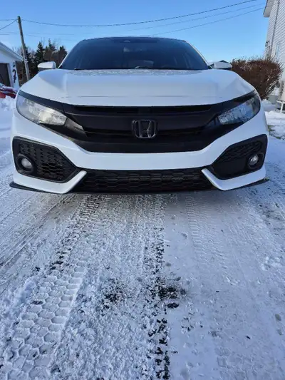 Selling my 2019 Honda Civic Sport Touring, a sleek and sporty hatchback with a peppy engine and prem...