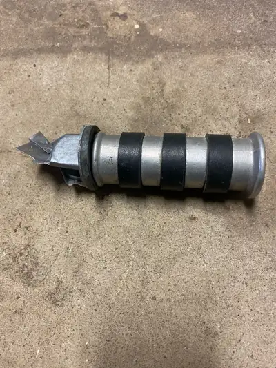 This is a single replacement motorcycle foot peg in used condition, from a Honda Shadow 600. Also wo...