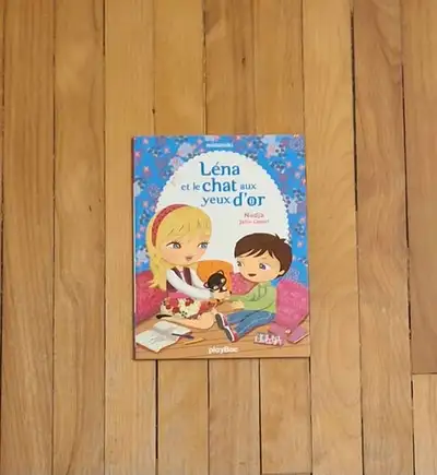 Livre: $1. LÉNA ET LE CHAT AUX YEUX D'OR. /NADJA. 6-9 ans., View more