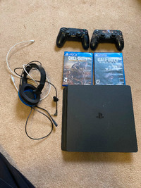 Used PS4 including 2 controllers, headset,  charger, and 2 games