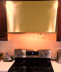 Custom made 36” brass kitchen range exhaust fan hood.