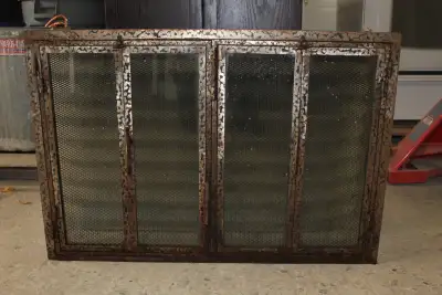Cabinet style fireplace screen with glass doors. Used, great condition. Fits 36" wide x 25" high ope...
