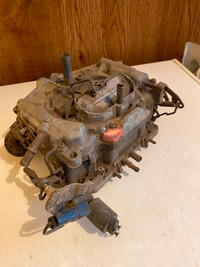 Carter Thermoquad 4 barrel carburetor.