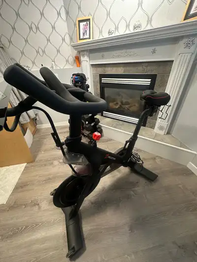 This is a used Peloton Bike in good condition, perfect for at-home workouts with its smooth magnetic...