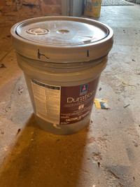 Full unopened 5 gallon paint jug