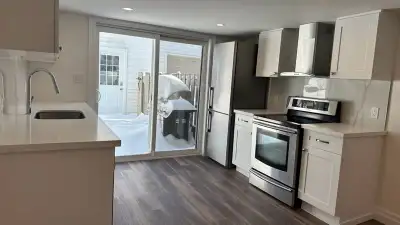 This bright and spacious 1-bedroom apartment features an open-concept kitchen, dining, and living ar...