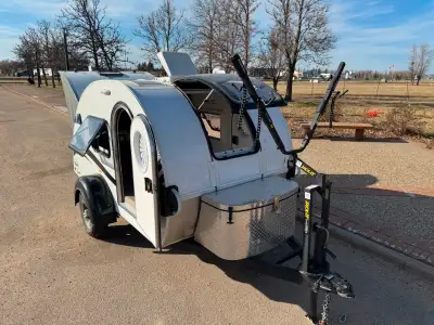 This NuCamp T@g teardrop travel trailer which comes standard with an air conditioner, a microwave an...