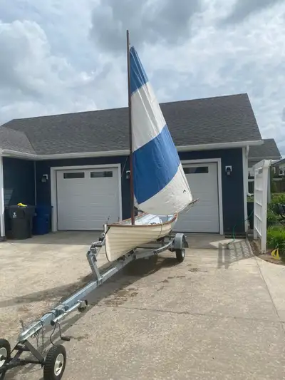 Whitehall style row boat with sail package and trailer. Will sell the boat without the trailer for $...