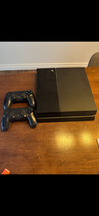 PlayStation 4 w/ 2 controllers & 12 games