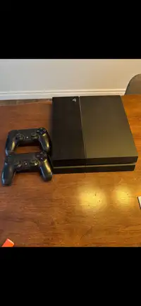 PlayStation 4 w/ 2 controllers & 12 games