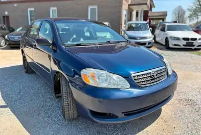 This pre-owned 2007 Toyota Corolla is a reliable sedan featuring a fuel-efficient engine and a comfo...