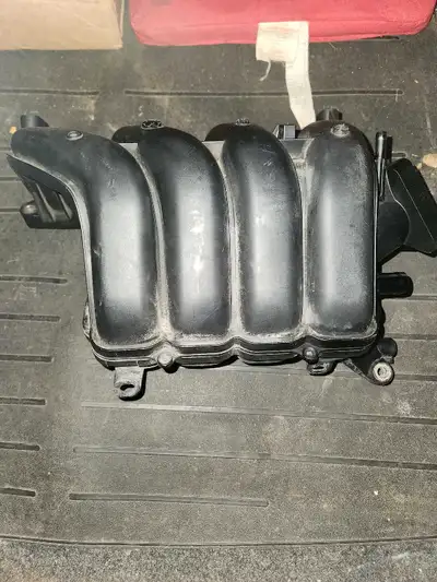 Intake manifold for Toyota Corolla. Was taken off a 2014 but will fit other years as well. Part # 17...