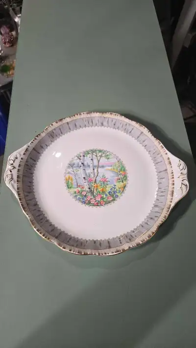 This elegant Royal Albert Silver Birch bone china cake plate features a beautiful pastoral landscape...