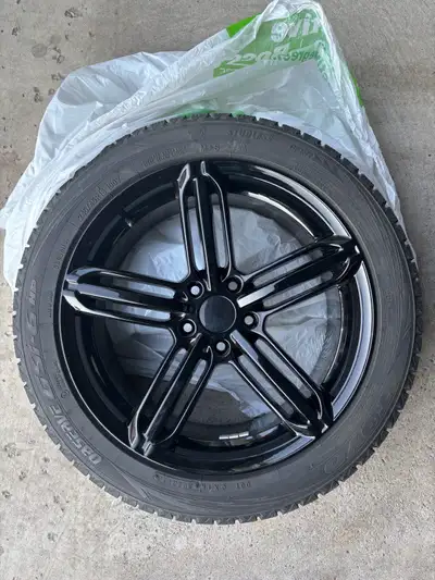 Freshly Powder coated 18 inch Black rims and winter tires. Tires only used for one season. Fits Audi...
