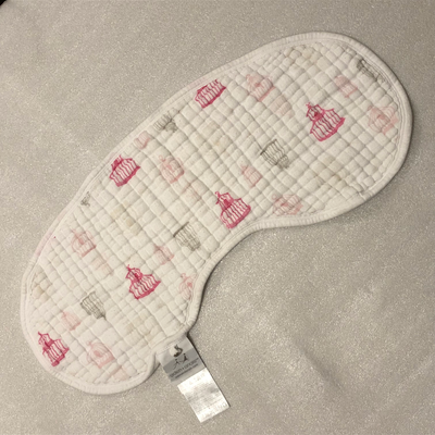 Aden + Anais Burpy Bib, can double as a bib and burp cloth. Drape it over baby's shoulders and snap...