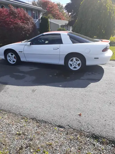 Low mealage automatic Z28, 46,455 km. white with factory orange stripes, mint original condition. Ca...