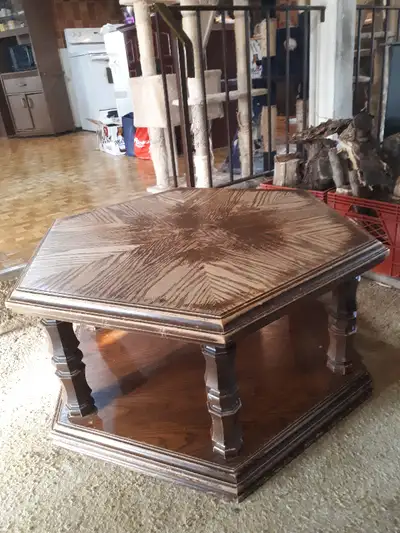 This is a wood hexagon coffee table. It is 17 1/2" high by 37" point to point and 32" from table top...