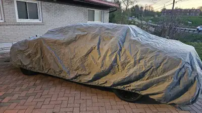 Large size car cover in mint condition. It will fit any size sedan cars. Maybe even compact SUVs.