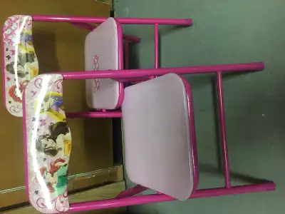 Two chairs for kids with safety pins.