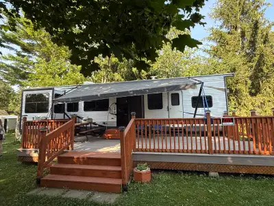 Has 4 Slide-outs Both Sofas convert to beds Both Sheds are included Composite deck included - approx...