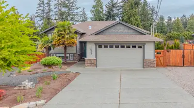 Expansive Madrona Heights Family Home! Set on a beautifully landscaped .50-acre lot, this spacious 6...