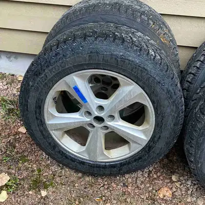 4 studded winter tires c/w rims and tps sensors used 1 winter