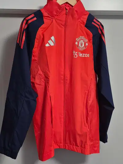 Step out in style with this Adidas Manchester United jacket, perfect for showing your team spirit on...