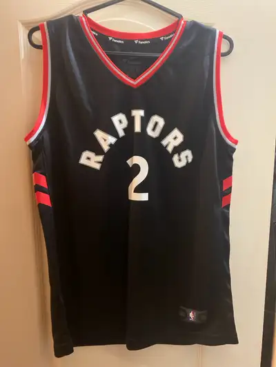 I have a used in great condition Kawahi Leonard Fanatics Raptors #2 youth X-Large black/red From a s...