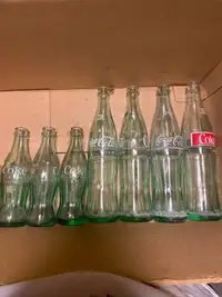 Coca Cola bottles glasses and other