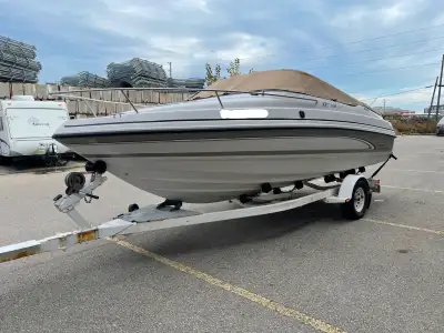 19-foot fiberglass cuddy cabin boat designed for family recreation, featuring a deep-V hull, an 8-fo...