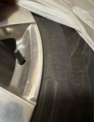 Get ready for winter with these Cooper studded winter tires, size 255/65R18, mounted on Jeep rims! T...