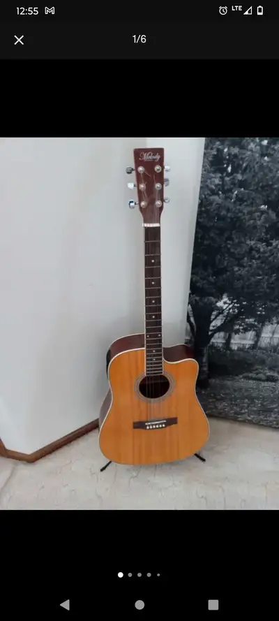 MINT CONDITION 6 STRING MELODY ACOUSTIC GUITAR! ONLY $195, View more