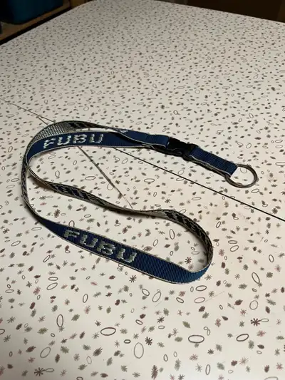 Cool navy on cream Fubu lanyard. Only have the one. Brand new.