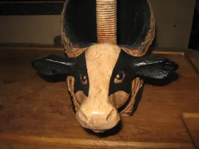 Cow basket wood and leather and rattan construction Dont know how old it may be we have had it for o...