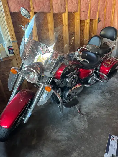 Excellent condition, black and red Kawasaki Vulcan Nomad with upgraded Vance & Hines pipes, stored i...