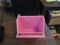pink food dish (for bird cage)