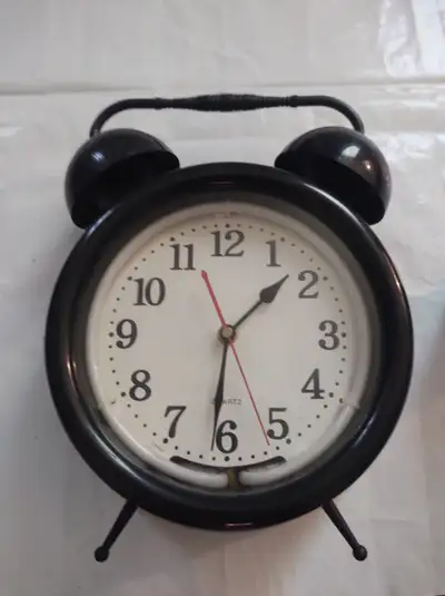 Larger Clock with LCD Light... Lost Power cord to power the LCD Light, but should be easy to find a...